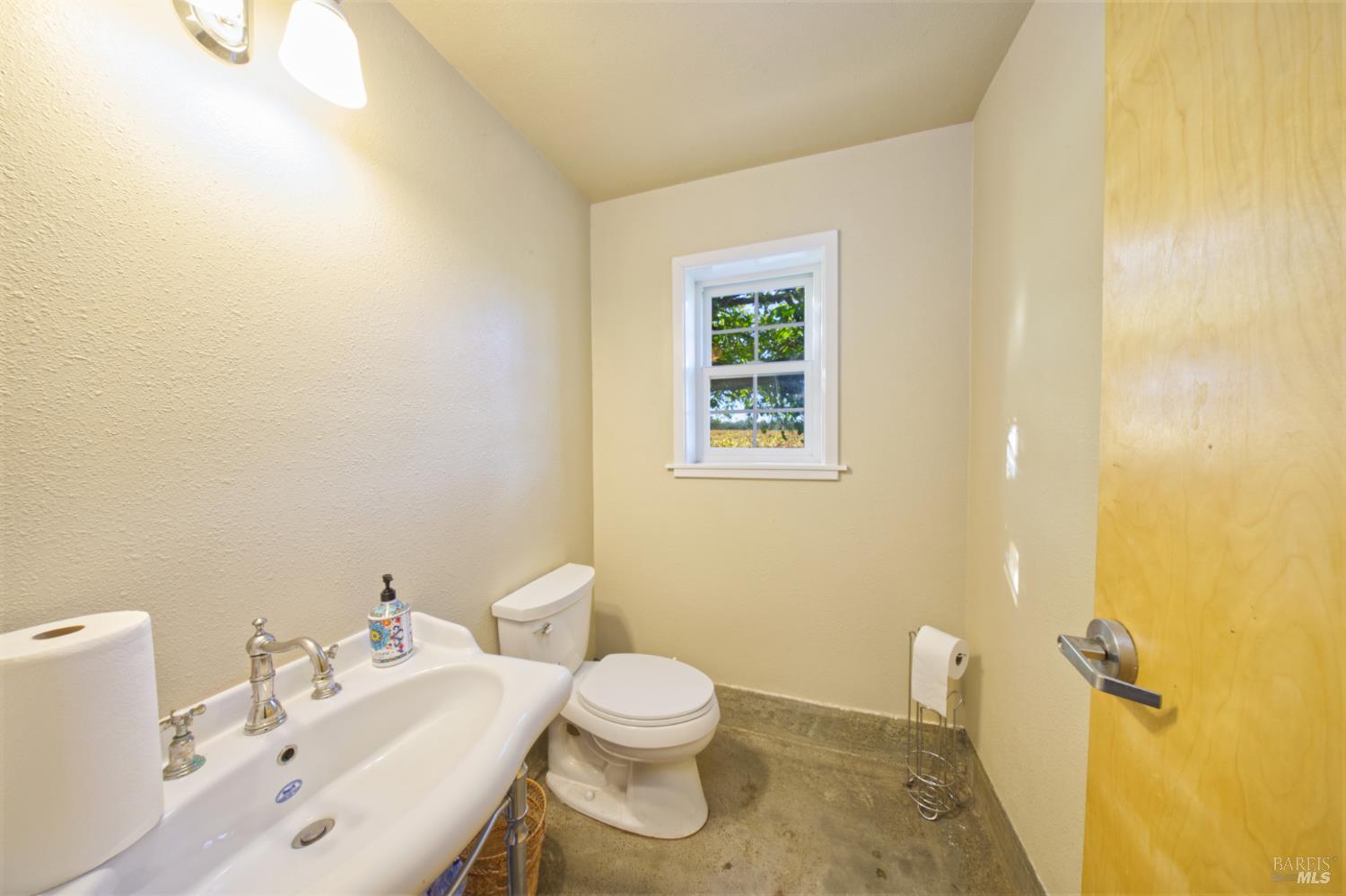 1623 Willowside Road Santa Rosa, CA 95401 - Photo 31 of 47 a bathroom with a sink toilet and a mirror