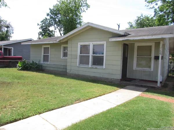 a view of a house with a yard