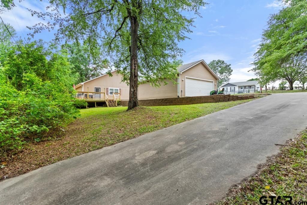 448 North Hill Road Tyler, TX 75706 - Photo 1 of 30 a front view of a house with a yard and garage