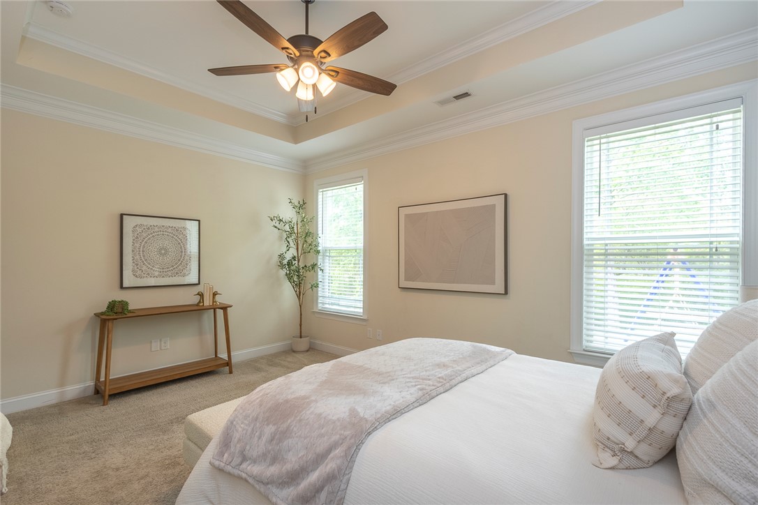234 Streams Way Anderson, SC 29625 - Photo 27 of 44 This spacious bedroom offers serene comfort with elegant design elements and abundant natural light.