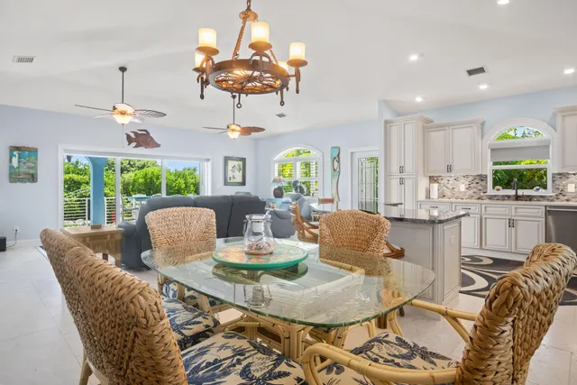 a view of an outdoor dining space with furniture and garden