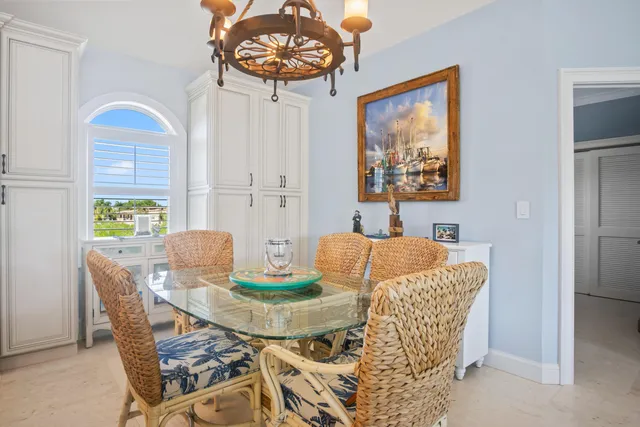 a balcony with furniture and a floor to ceiling window