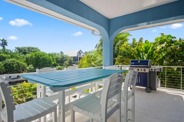 a spacious bathroom with a double vanity sink a mirror and shower