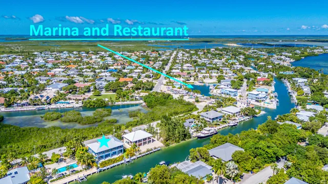 a view of houses with yard and outdoor seating