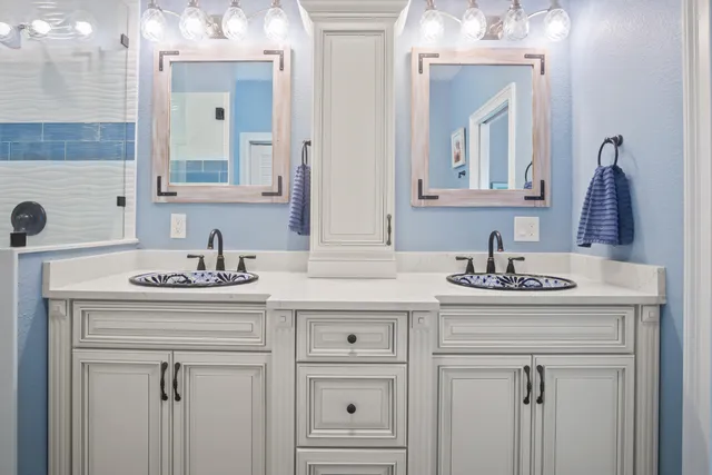 a bathroom with a window and a shower