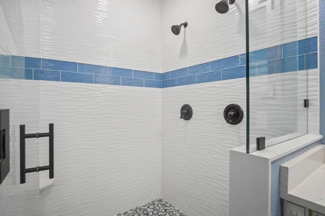 a en suite bathroom with a sink and mirror