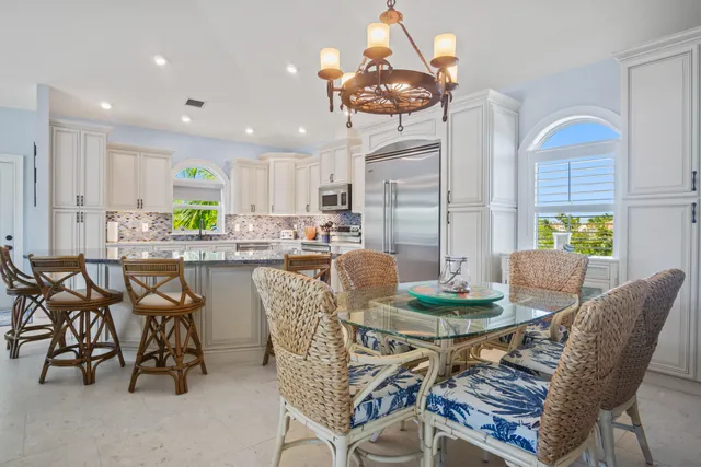 a kitchen with a sink appliances and cabinets