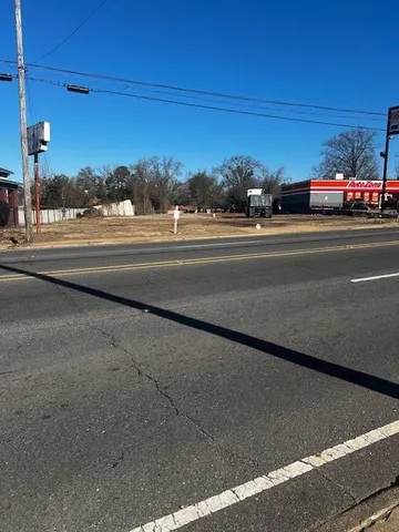 a view of street with parked cars