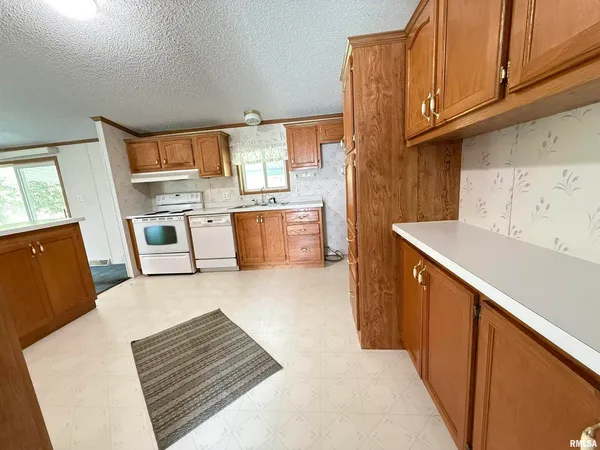 a view of kitchen and sink