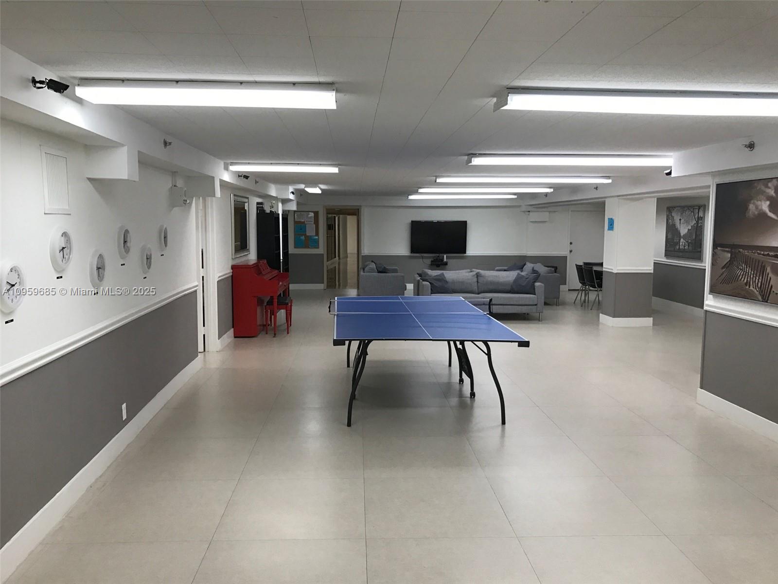 100 Lincoln Road, Unit 719 Miami Beach, FL 33139 - Photo 33 of 50 a lobby with furniture and a potted plant