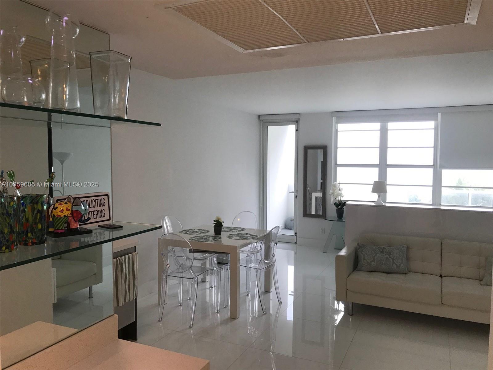 100 Lincoln Road, Unit 719 Miami Beach, FL 33139 - Photo 10 of 50 a living room with furniture and a window