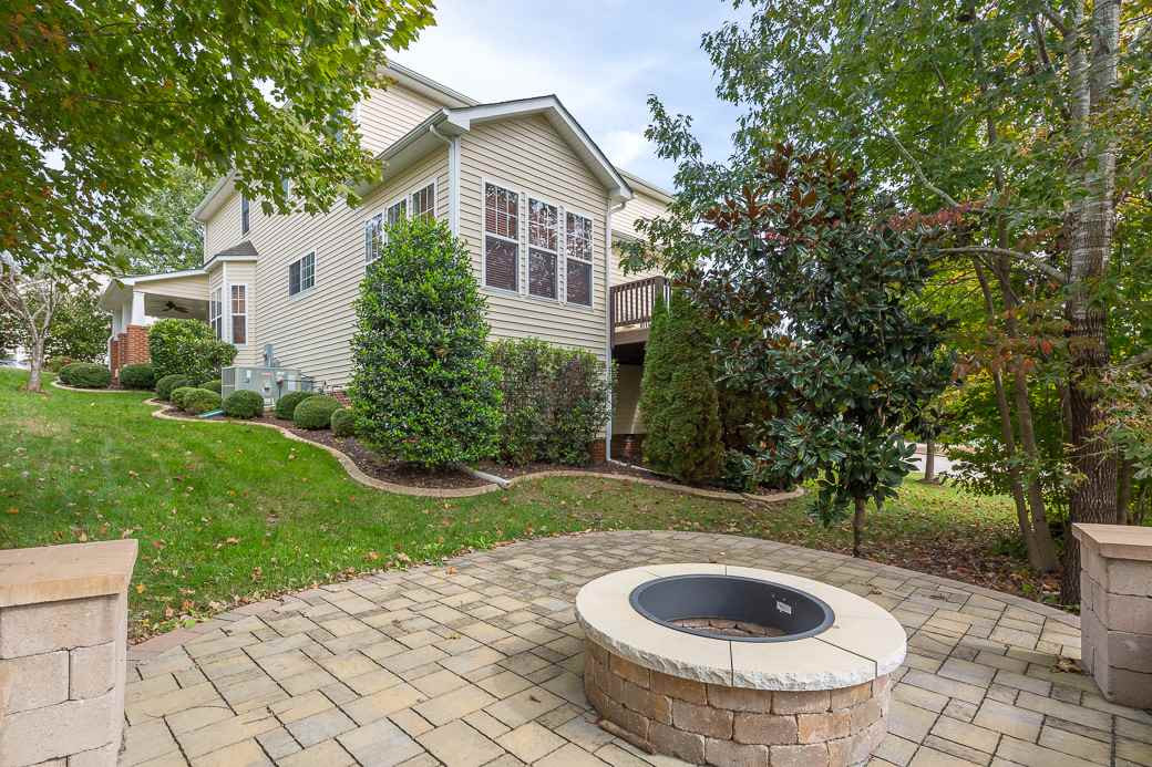 159 Locke Woods Road Raleigh, NC 27603 - Photo 12 of 17 Brand new deck and custom patio with stone fire pit! Indoor/outdoor living at it's finest! Exterior Back