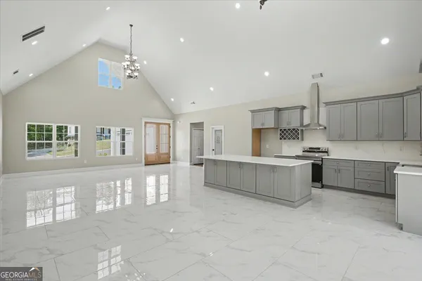 a kitchen with a sink appliances and cabinets