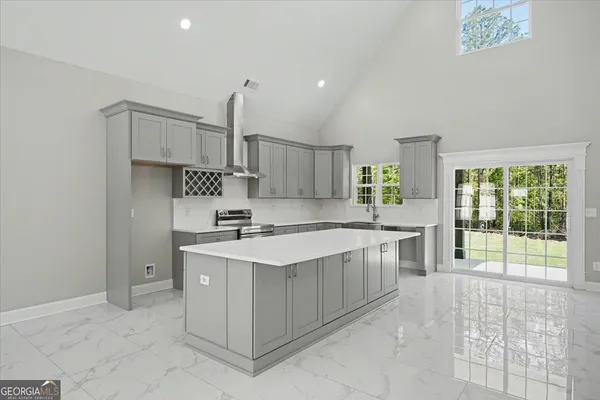 a kitchen with a sink and cabinets