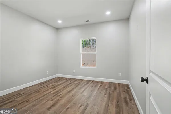 a bathroom with a shower and a sink