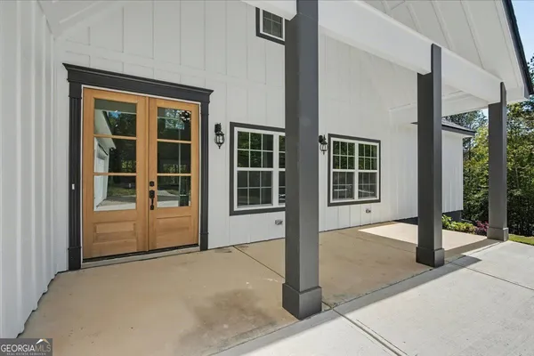 a front view of a house with a glass door and glass door
