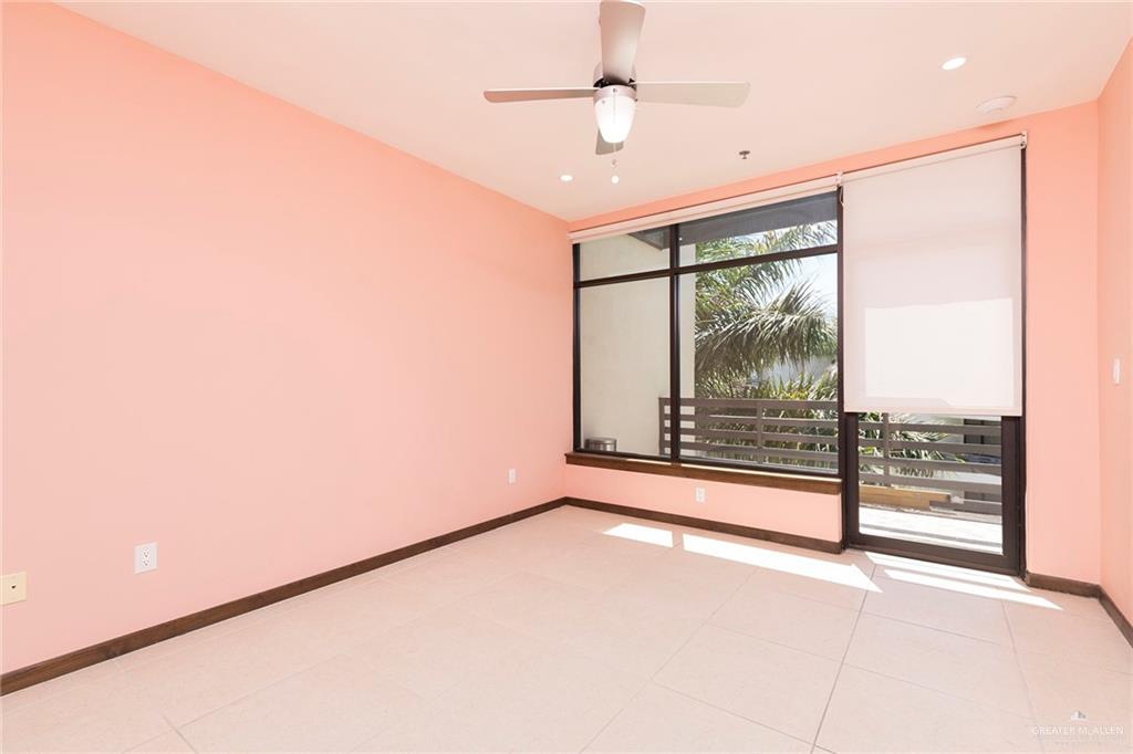 813 Travis Street, Unit 416 Mission, TX 78572 - Photo 12 of 32 a view of an empty room with a window