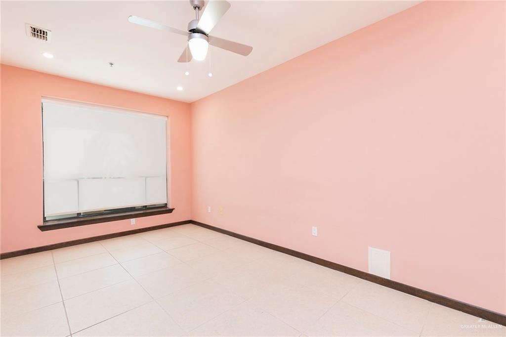813 Travis Street, Unit 416 Mission, TX 78572 - Photo 15 of 32 a view of an empty room with a window