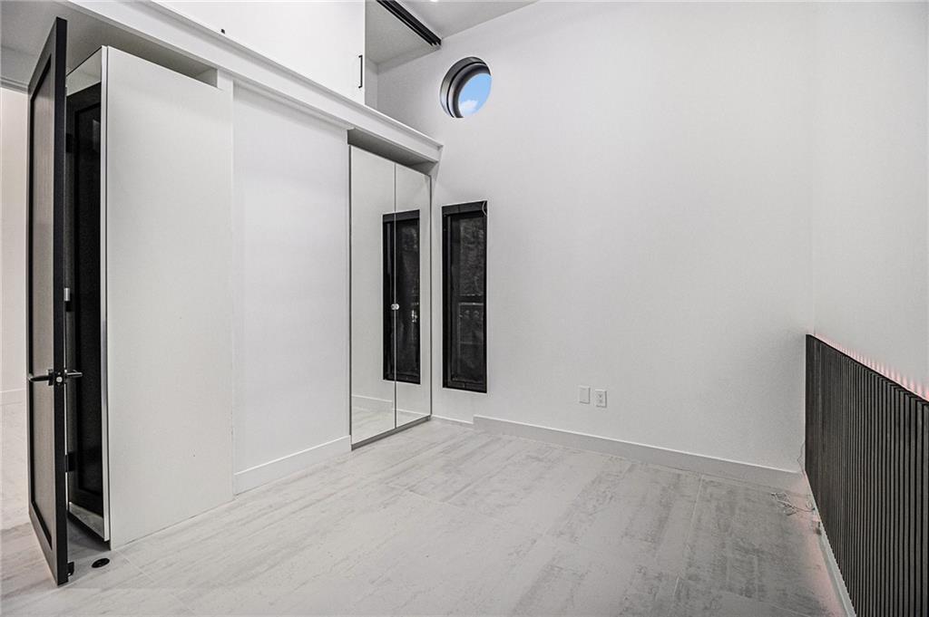 199 14th Street Northeast, Unit 103 Atlanta, GA 30309 - Photo 16 of 32 a view of an empty room