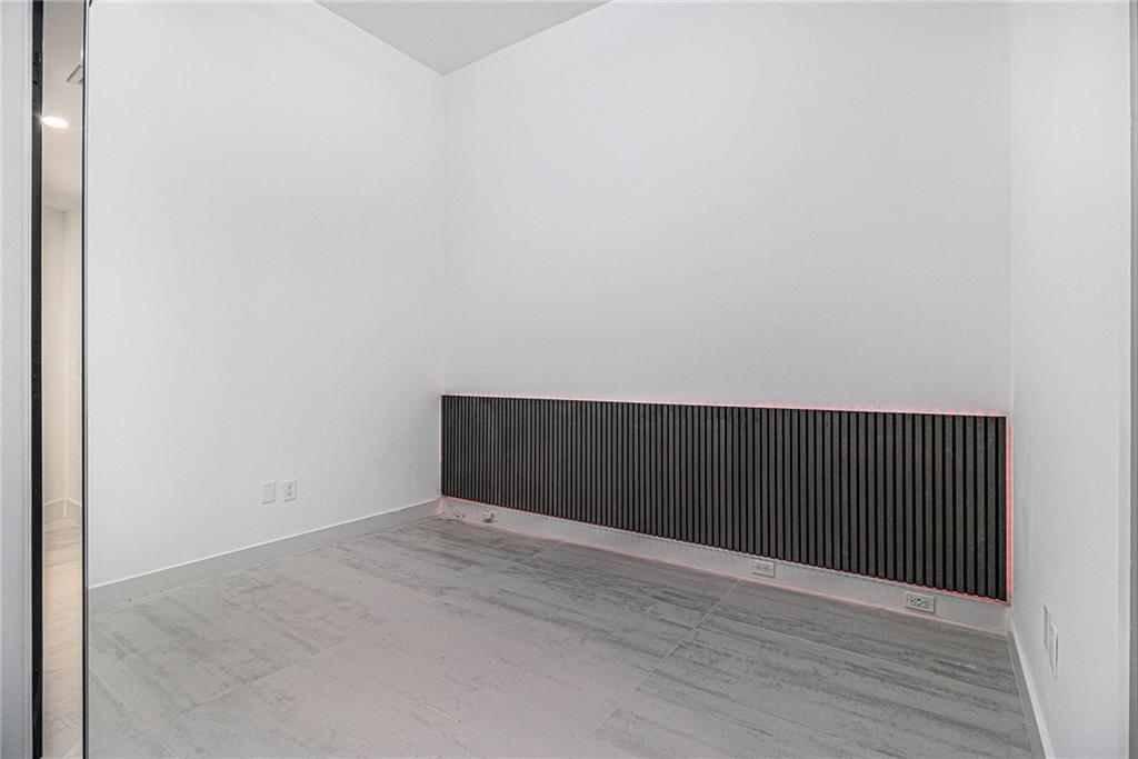 199 14th Street Northeast, Unit 103 Atlanta, GA 30309 - Photo 19 of 32 a view of an empty room