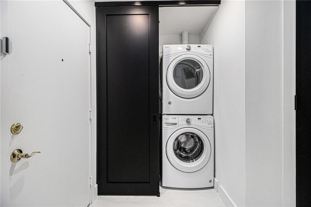 199 14th Street Northeast, Unit 103 Atlanta, GA 30309 - Photo 24 of 32 a utility room with dryer and washer