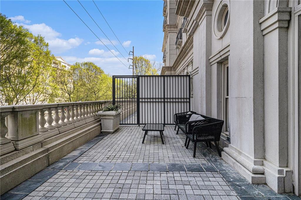 199 14th Street Northeast, Unit 103 Atlanta, GA 30309 - Photo 25 of 32 a view of a chairs on the roof deck
