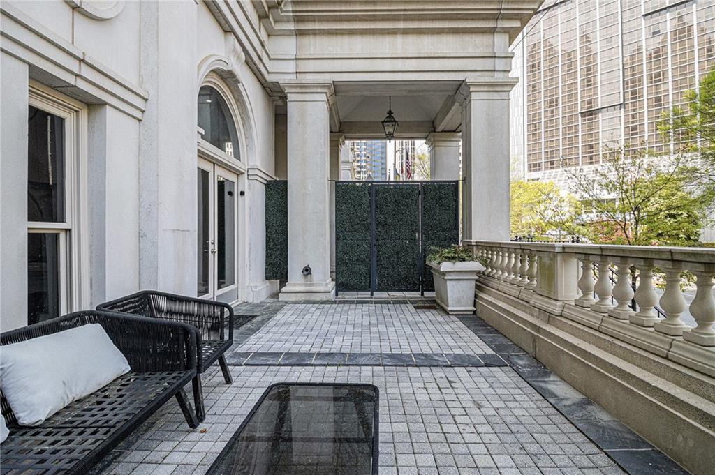 199 14th Street Northeast, Unit 103 Atlanta, GA 30309 - Photo 28 of 32 a view of a balcony with furniture