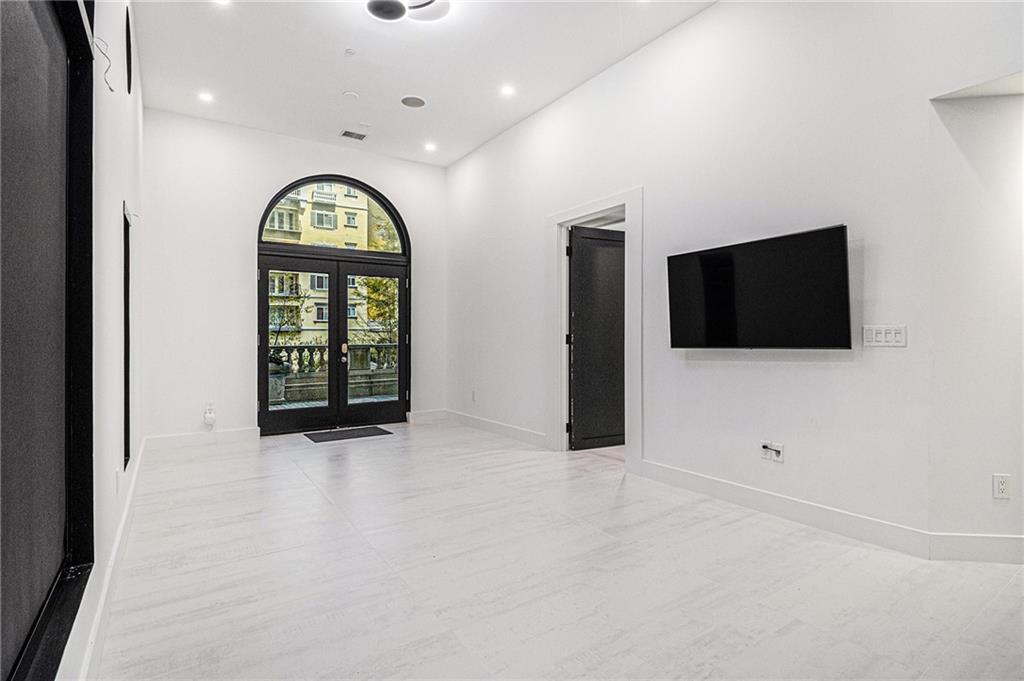 199 14th Street Northeast, Unit 103 Atlanta, GA 30309 - Photo 5 of 32 a view of an empty room with a window