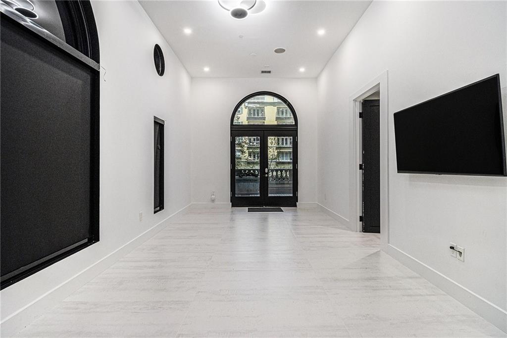 199 14th Street Northeast, Unit 103 Atlanta, GA 30309 - Photo 6 of 32 a view of a livingroom with furniture and window