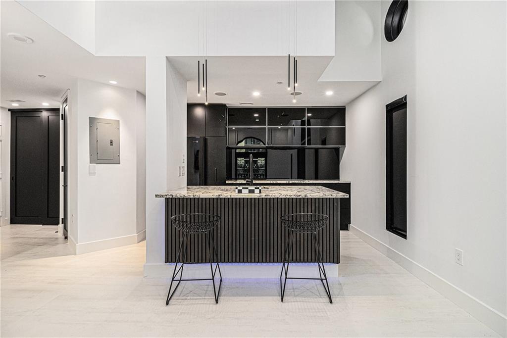 199 14th Street Northeast, Unit 103 Atlanta, GA 30309 - Photo 9 of 32 a view of kitchen with refrigerator and window