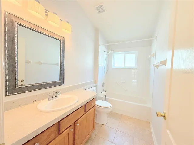 a bathroom with a sink a toilet and a bathtub