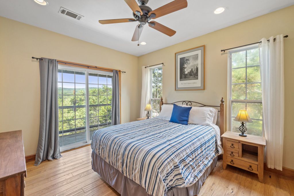 10800 Beach Road Leander, TX 78641 - Photo 27 of 39 Hardwood floors and generous windows frame inspiring outdoor vistas in this well-appointed sleep sanctuary.