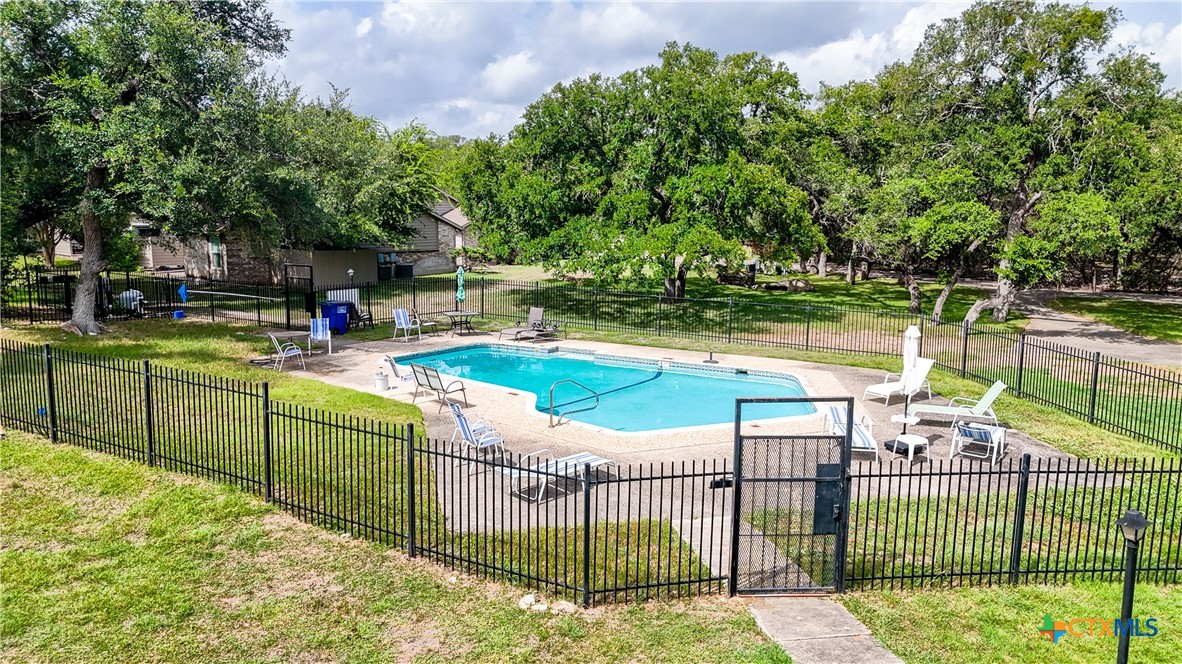8 Oak Villa Road, Unit G2 Canyon Lake, TX 78133 - Photo 16 of 17 a view of a wrought iron fences with iron fence