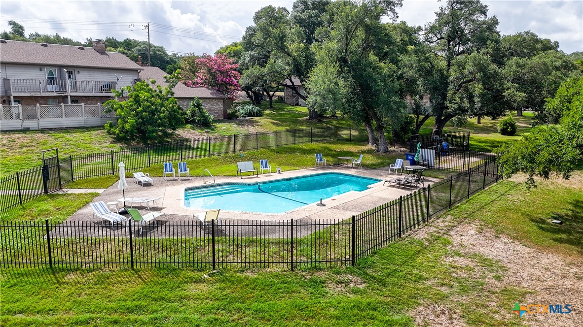 8 Oak Villa Road, Unit G2 Canyon Lake, TX 78133 - Photo 17 of 17 a view of a house with a yard and sitting area