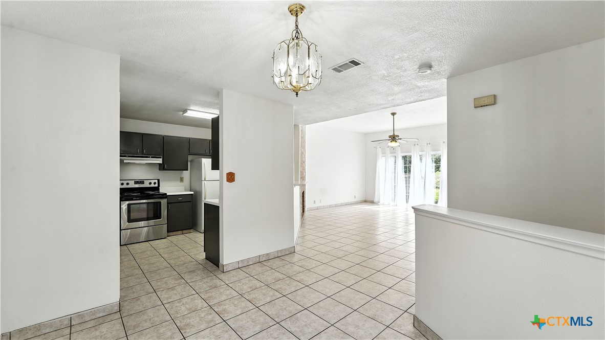 8 Oak Villa Road, Unit G2 Canyon Lake, TX 78133 - Photo 7 of 17 a view of a hallway with dining area