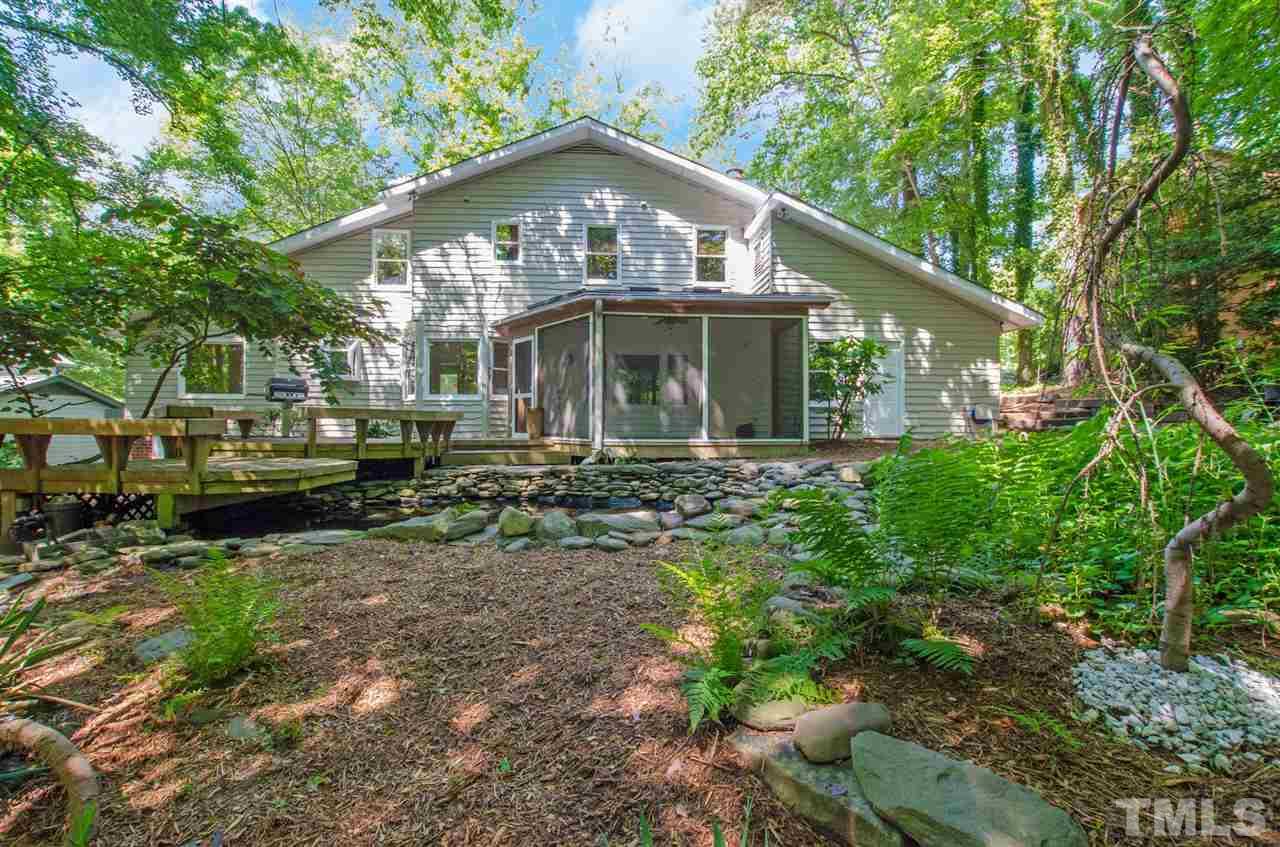 6205 Lookout Loop Raleigh, NC 27612 - Photo 1 of 25 a front view of a house with garden