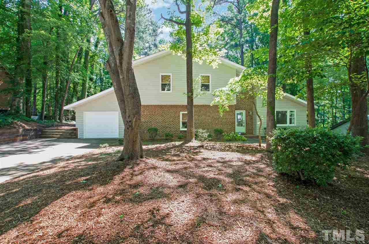 6205 Lookout Loop Raleigh, NC 27612 - Photo 2 of 25 a view of a house with a tree in front of it