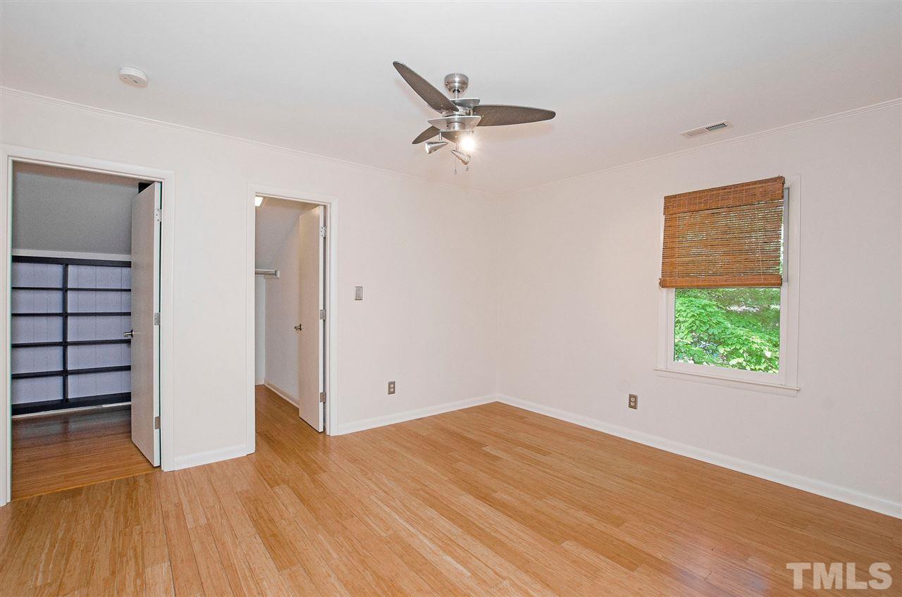 6205 Lookout Loop Raleigh, NC 27612 - Photo 16 of 25 wooden floor in an empty room with a window
