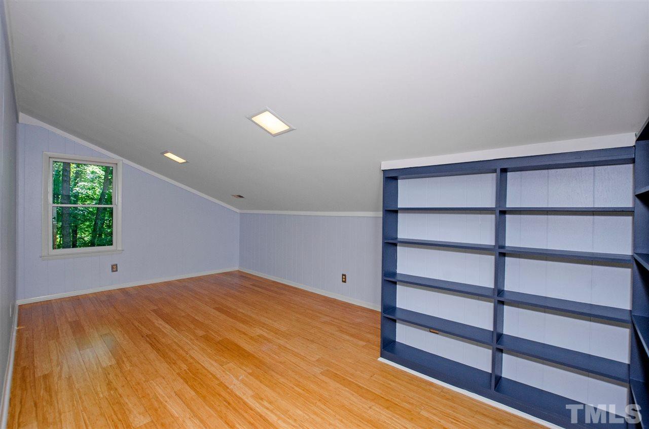6205 Lookout Loop Raleigh, NC 27612 - Photo 17 of 25 a view of a room with wooden floor and window