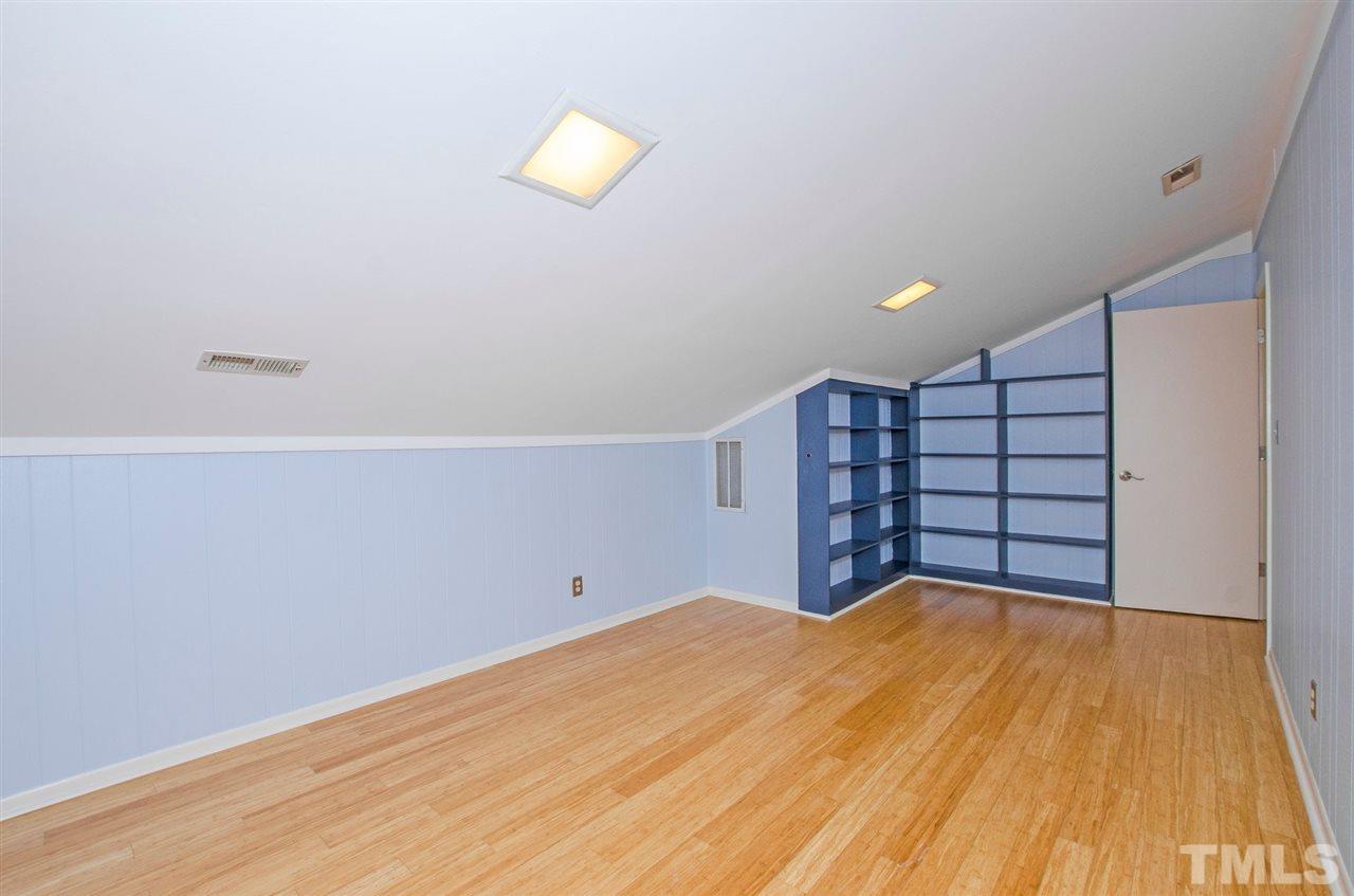 6205 Lookout Loop Raleigh, NC 27612 - Photo 18 of 25 a view of a room with a wooden floor