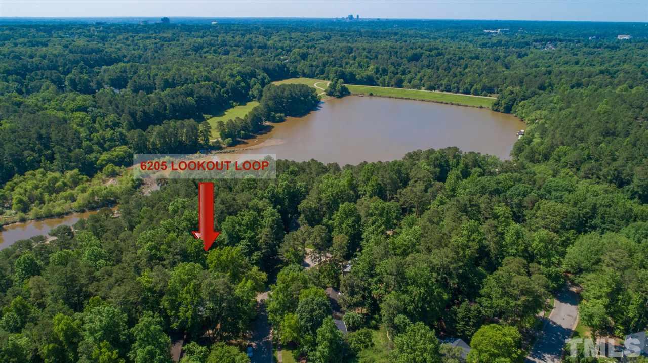 6205 Lookout Loop Raleigh, NC 27612 - Photo 22 of 25 an aerial view of a house with a yard and outdoor seating