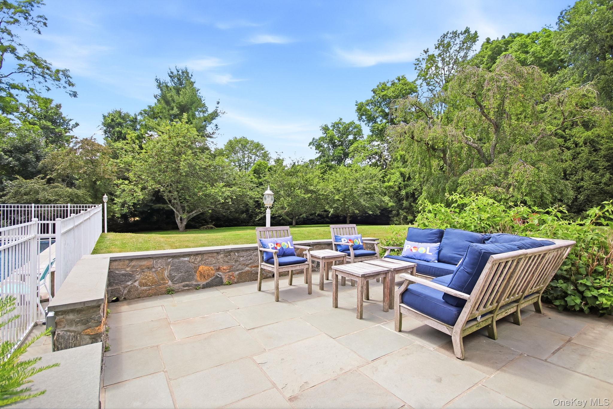 26 Century Ridge Road Purchase, NY 10577 - Photo 36 of 50 Expansive patio with a stone retaining wall