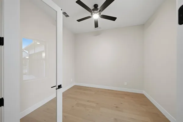a view of room with window and hardwood floor