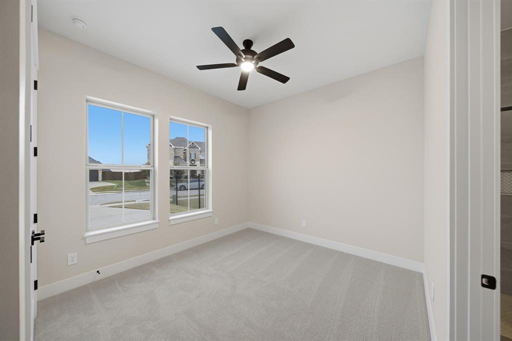 1902 Pebble Lane Rockwall, TX 75087 - Photo 18 of 35 a view of an empty room with a window