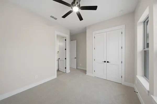 a view of a kitchen with a sink and a refrigerator