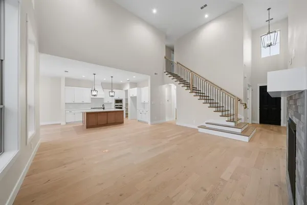 a kitchen with white cabinets and oven