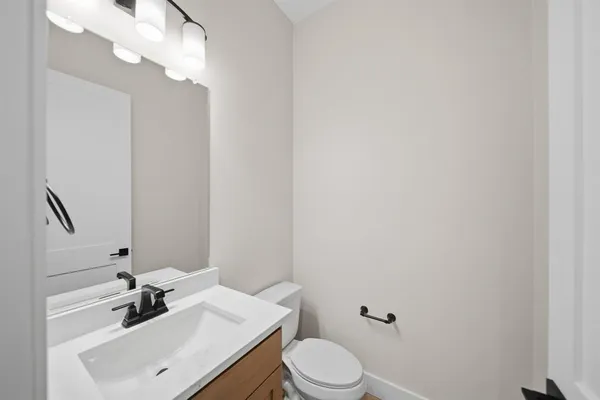 a spacious bathroom with a double vanity sink mirror and double