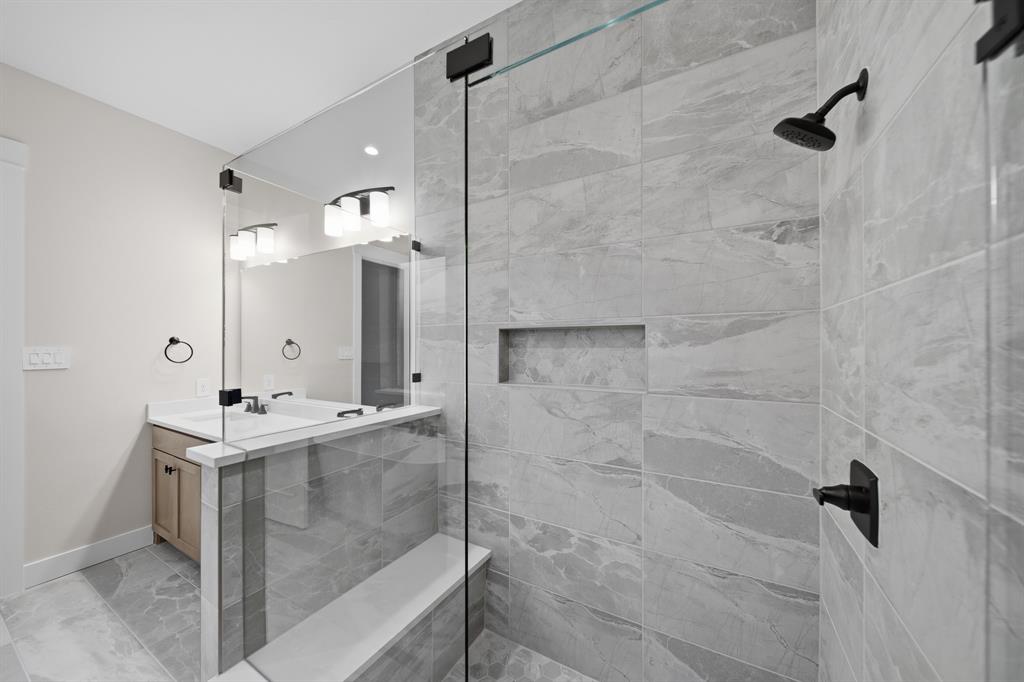 1902 Pebble Lane Rockwall, TX 75087 - Photo 28 of 35 a bathroom with a sink mirror and shower