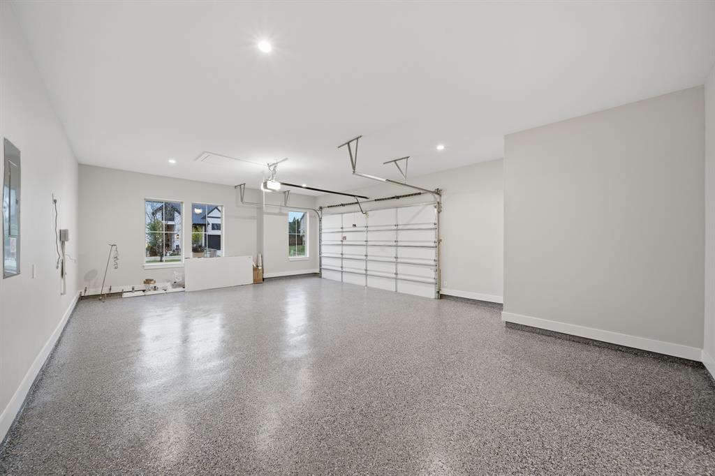 1902 Pebble Lane Rockwall, TX 75087 - Photo 29 of 35 an empty room with windows and pillars in it