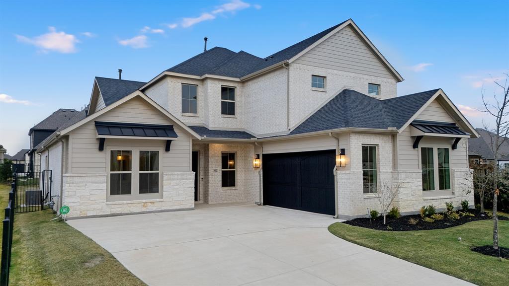 1902 Pebble Lane Rockwall, TX 75087 - Photo 4 of 35 a front view of a house with a yard